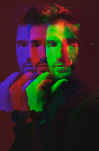 Man, face and double exposure with portrait, fashion with watch and neon overlay isolated on studio background. Color, creative aesthetic and style, art and cosmetics, dark with special effects