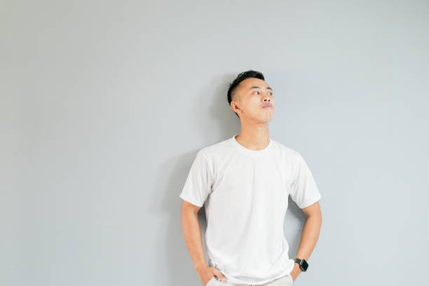 istock a young asian man is showing thinking gestures 1480561339