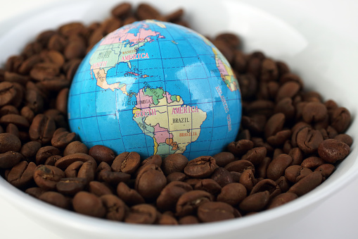 Coffee beans with globe, Coffee industry in the World Concept.