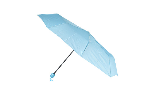 Opened light blue umbrella isolated on white background, cut out, clipping path, studio shot
