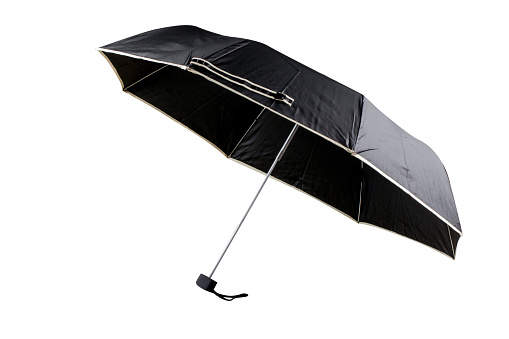 Opened black umbrella with white curb isolated on white background, cut out, clipping path, studio shot