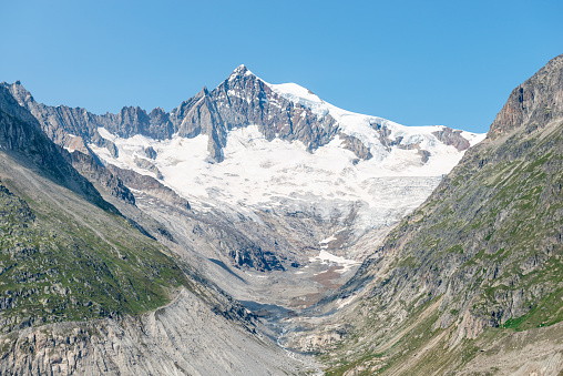 mountain landscape with snowy mountain peaks. a sight you see when hiking in the Alps, near the Aletsch Glacier in the swiss alps in the canton of Valais. Near Fiescheralp, Bettmeralp and the Eggishorn in the Jungfrau region, Switzerland.
