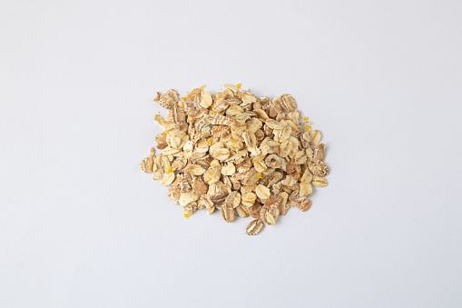 sprinkled oatmeal on a white background