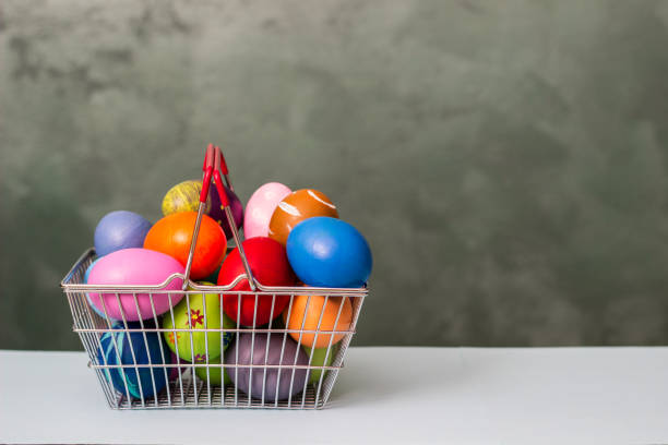 Easter eggs in the shopping basket stock photo