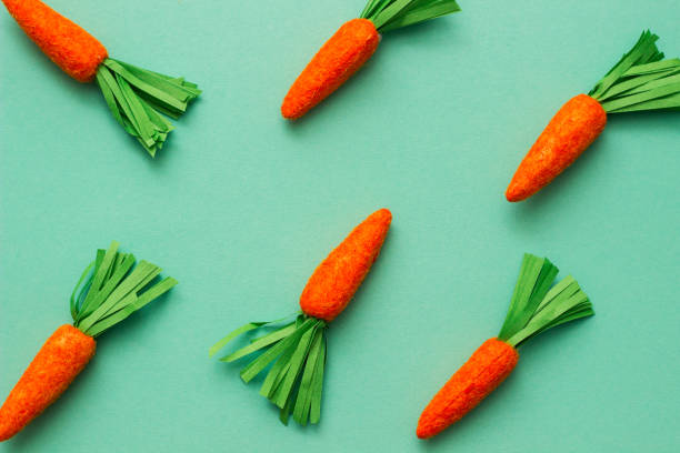 istock Carrots on pastel green. Minimal Easter concept 1480568625