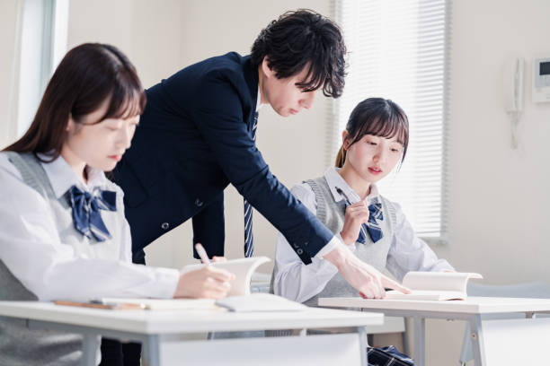 istock A high school student receiving guidance from her teacher 1480569827