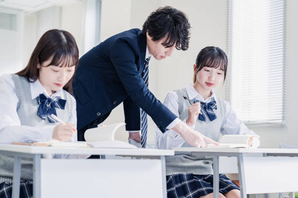 istock A high school student receiving guidance from her teacher 1480569829