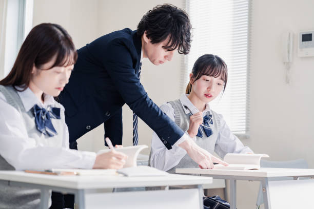 istock A high school student receiving guidance from her teacher 1480569836