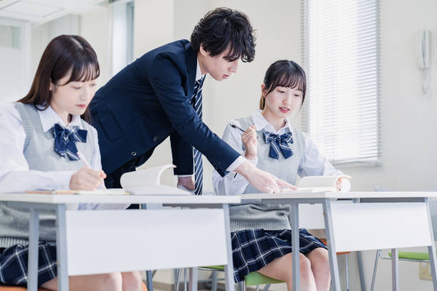 istock A high school student receiving guidance from her teacher 1480569847