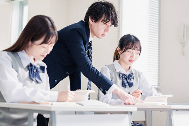 istock A high school student receiving guidance from her teacher 1480569848