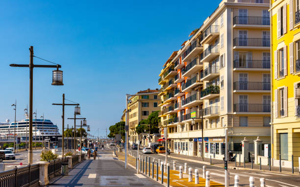 colorful tenement houses along quai papacino street in historic nice port district on french riviera in france - city of nice restaurant france french riviera imagens e fotografias de stock