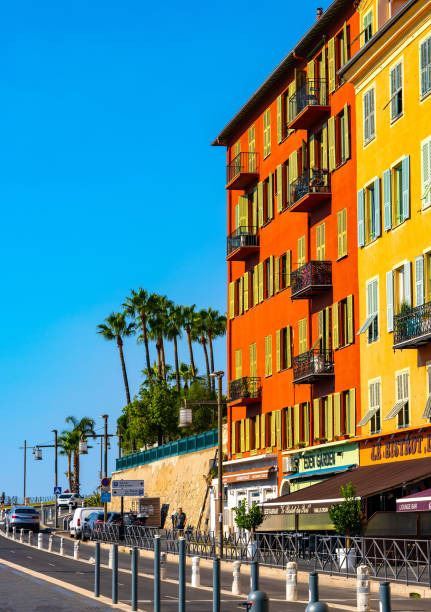 colorful tenement houses along quai papacino street in historic nice port district on french riviera in france - city of nice restaurant france french riviera imagens e fotografias de stock