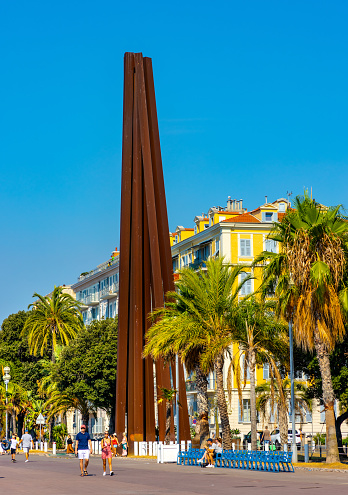 Nice, France - August 5, 2022: Neuf Lignes Obliques Nine Oblique Lines monument by Bernar Venet at Promenade des Anglais along Nice beach on French Riviera Azure Coast