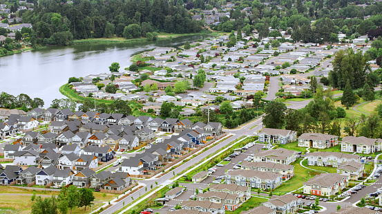 Aerial view of suburban neighbourhood homes along the river in city, Eugene, Oregon, USA.