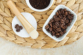 Roasted coffee beans for preparing homemade beauty mask and scrub. Natural skin and hair care. DIY beauty treatment and spa recipe.