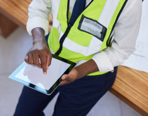 istock Engineer, hands and man with tablet screen while online for planning, schedule and search for design. Construction, engineering or industrial mobile app with ux mockup space for website innovation 1480572499