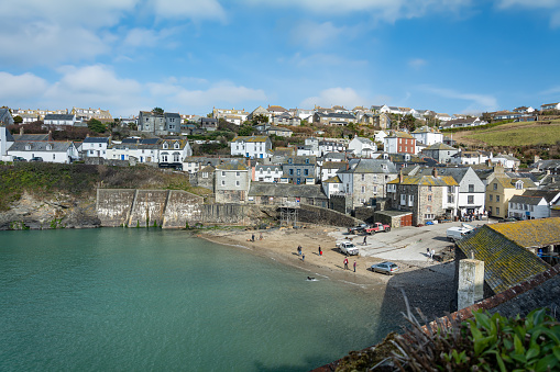 The village of Port Issac with fishing boats moored in the bay, Devon, England