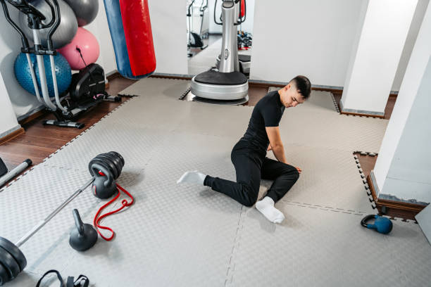 istock Young Man Stretching Before Working Out At The Gym 1480574718