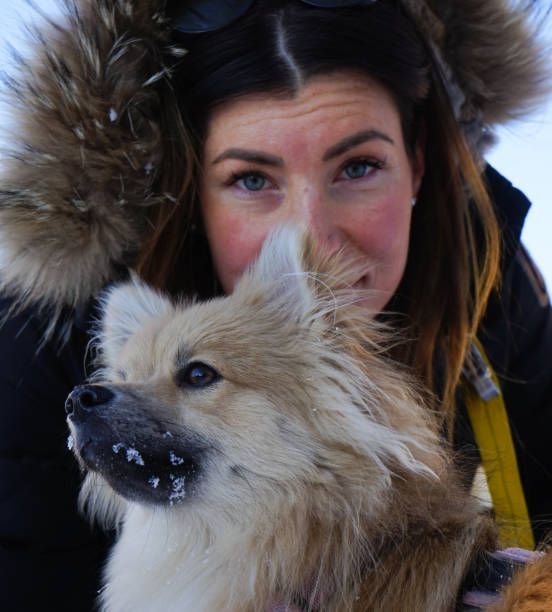 Woman with dog during a winter day