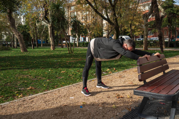 istock Mature man stretching in the park before jogging 1480579968