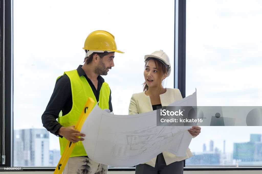 Team Engineers With Draft Plan Of Building On Constructing Site ...