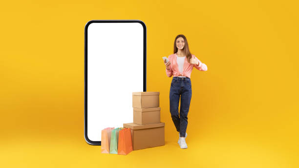 istock Female Near Big Smartphone Gesturing Thumbs Up Approving Shopping, Studio 1480589620