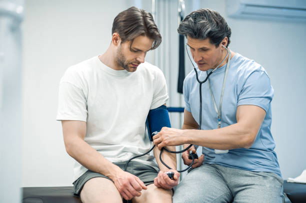 istock Doctor checking the patients blood presser 1480590215