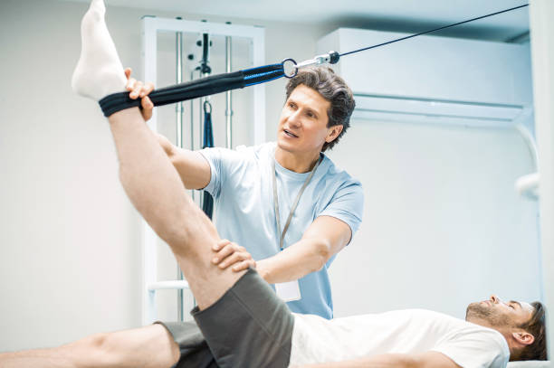 istock Physal therapist working with patients limb hyperextension 1480590254