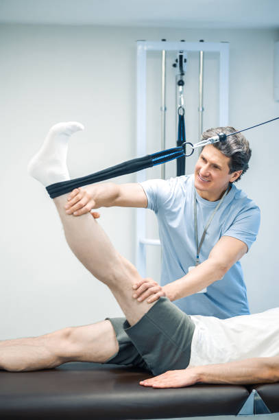 istock Physal therapist working with patients limb hyperextension 1480590259