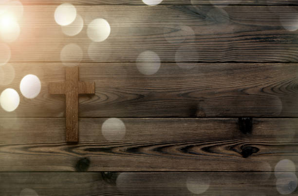 Religious cross on wooden background