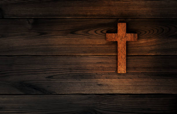 istock Religious cross on wooden background 1480592078