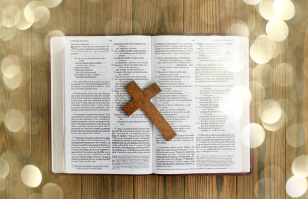 istock Bible and religious cross on wooden table 1480592124