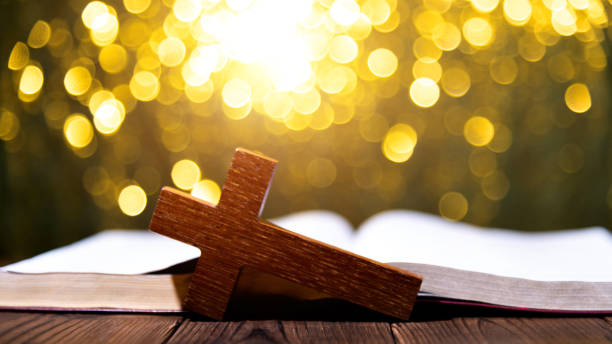 istock Bible and religious cross on wooden table 1480592162