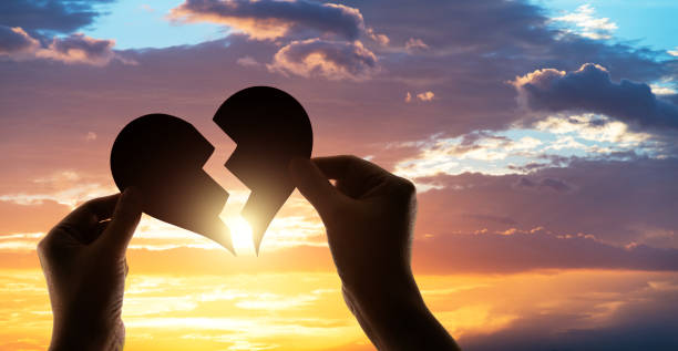 istock Woman hands holding broken heart 1480592279