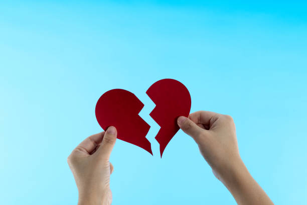 istock Woman hands holding broken heart 1480592314
