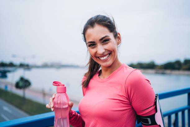 istock Sporty woman taking a break after running workout. 1480592824