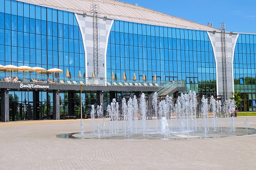 Belgorod region, Razumnoe, Russia - June 29, 2022: The building of the Belgorod all-season water park Lazurniy (azure). Main front facade with balcony porch. Fountain on Vladimirsky square.