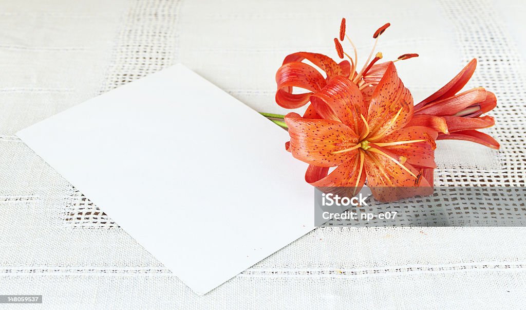 empty card and lily flowers card with a blank space for text and lilys at table Copy Space Stock Photo