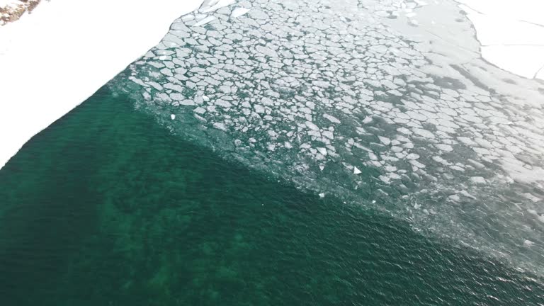 drone aerial view of cracks surface of the frozen lake of Baikal lake in winter season,Aerial view from the air. Winter. Ice Lake Baikal Russia