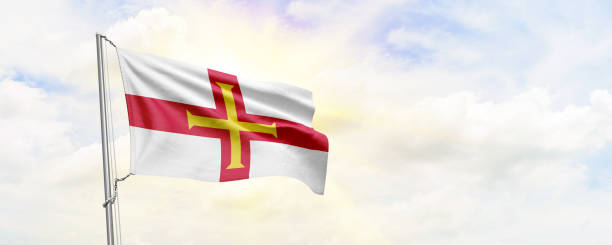 istock Guernsey flag waving on sky background. 3D Rendering 1480596975