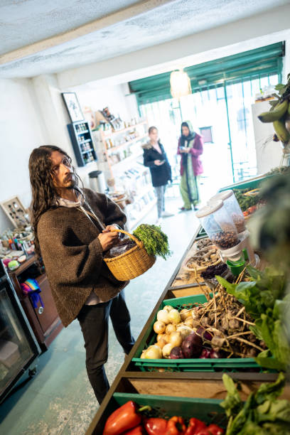 istock Mature man buying vegetables at small local store 1480597219