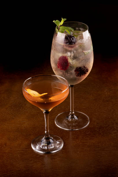 istock Two cocktail glasses on wooden table with top background 1480599855