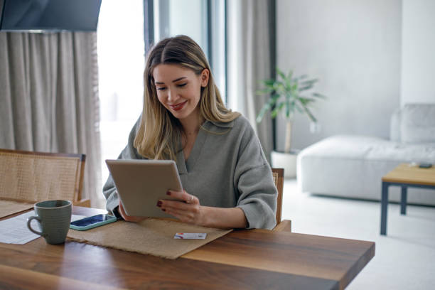 istock Beautiful young woman working at home 1480600204