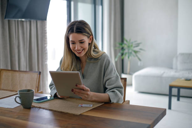 istock Beautiful young woman working at home 1480600216