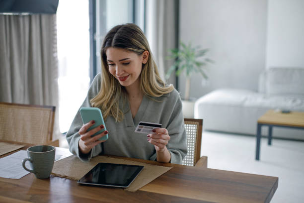 Beautiful young woman working at home stock photo