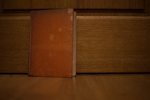 Antique brown leather hardcover book.