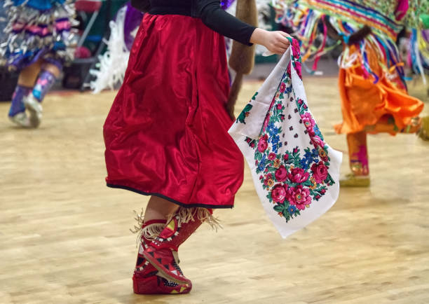 First Nations' Powwow at Earl Marriott Secondary School, White Rock, British Columbia — March 31 to April 2, 2023. This dancer is wearing colourful regalia. stock photo