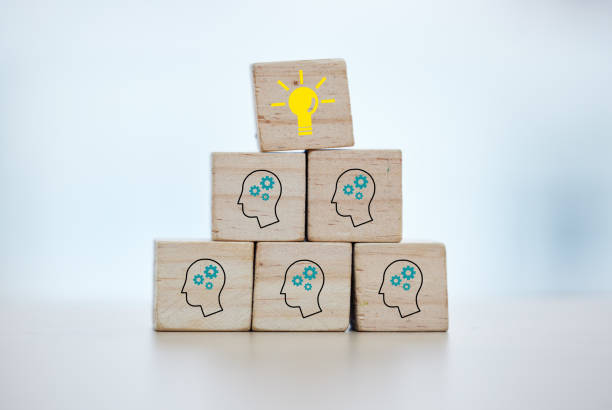 istock Building blocks, teamwork or brainstorming lightbulb idea on isolated background, mock up or office desk mockup. Zoom, wood or cube in cog head innovation for company thinking or unity growth success 1480602442