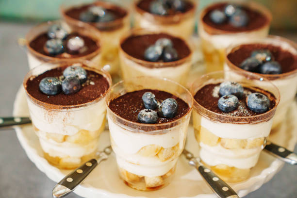 istock cups with dessert tiramisu with blueberries. 1480605379
