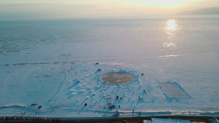 drone aerial view of cracks surface of the frozen lake of Baikal lake in winter season,Aerial view from the air. Winter. Ice Lake Baikal Russia